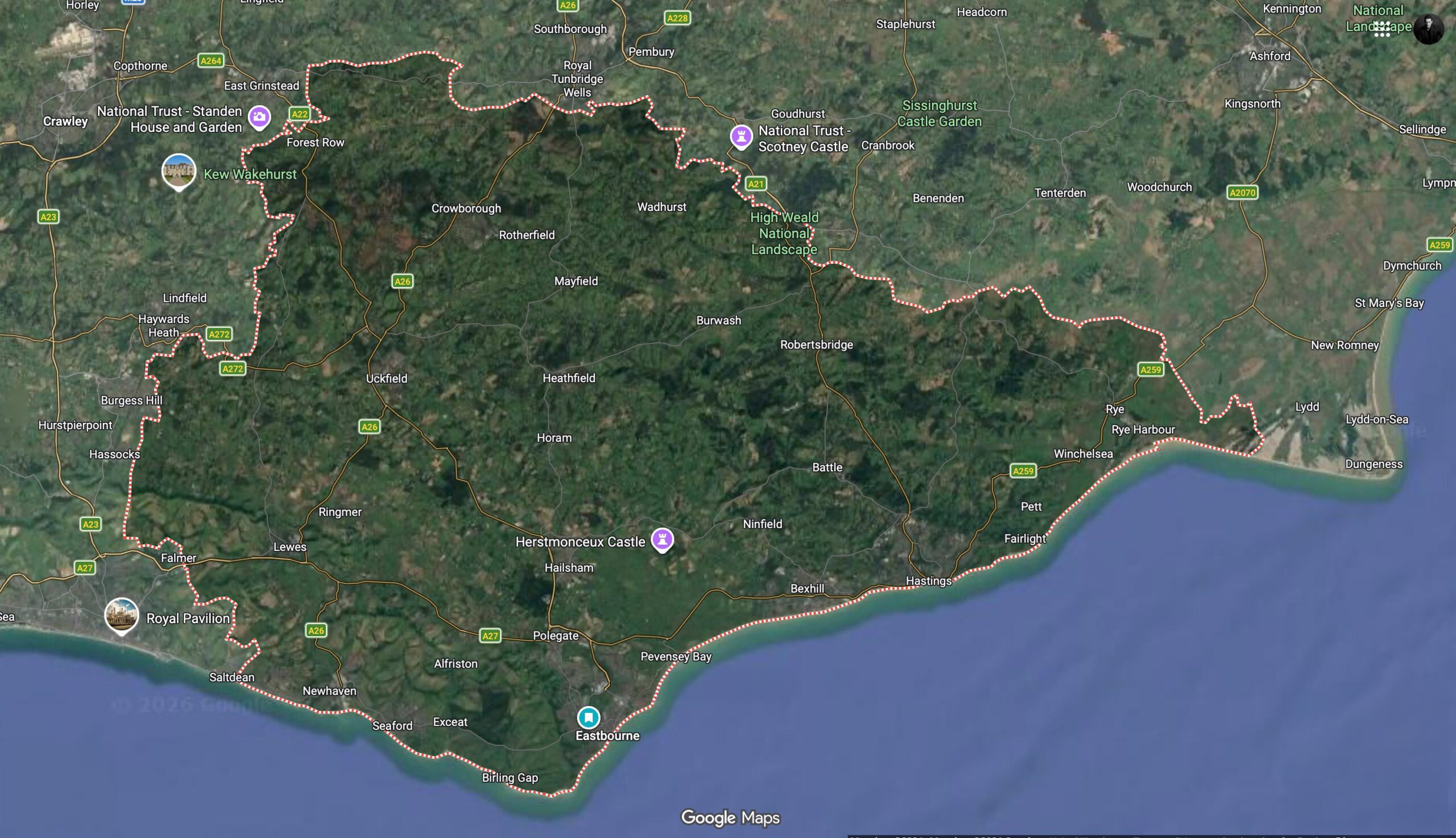 Satellite map showing the High Weald National Landscape in southeast England, outlined with a dotted pink boundary. The map includes locations such as Tunbridge Wells, East Grinstead, Uckfield, Hastings, Rye, Eastbourne, Brighton, and Ashford, along with landmarks including Wakehurst, Scotney Castle, Herstmonceux Castle, and the Royal Pavilion.
